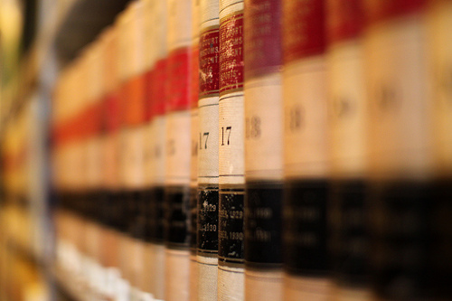 Image shows a stack of legal books to represent the sense of justice lost in this family law news story